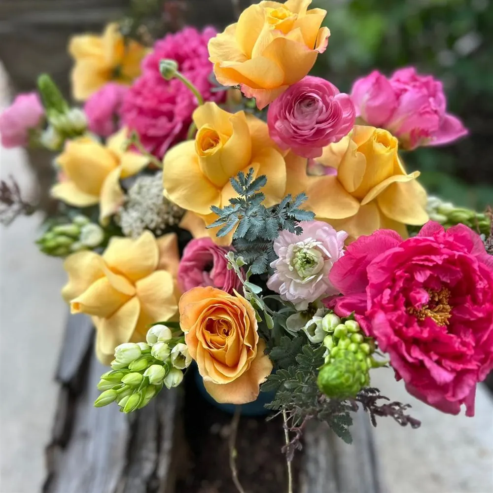 Yellow and pink custom flower arrangement by Vintage Blooms